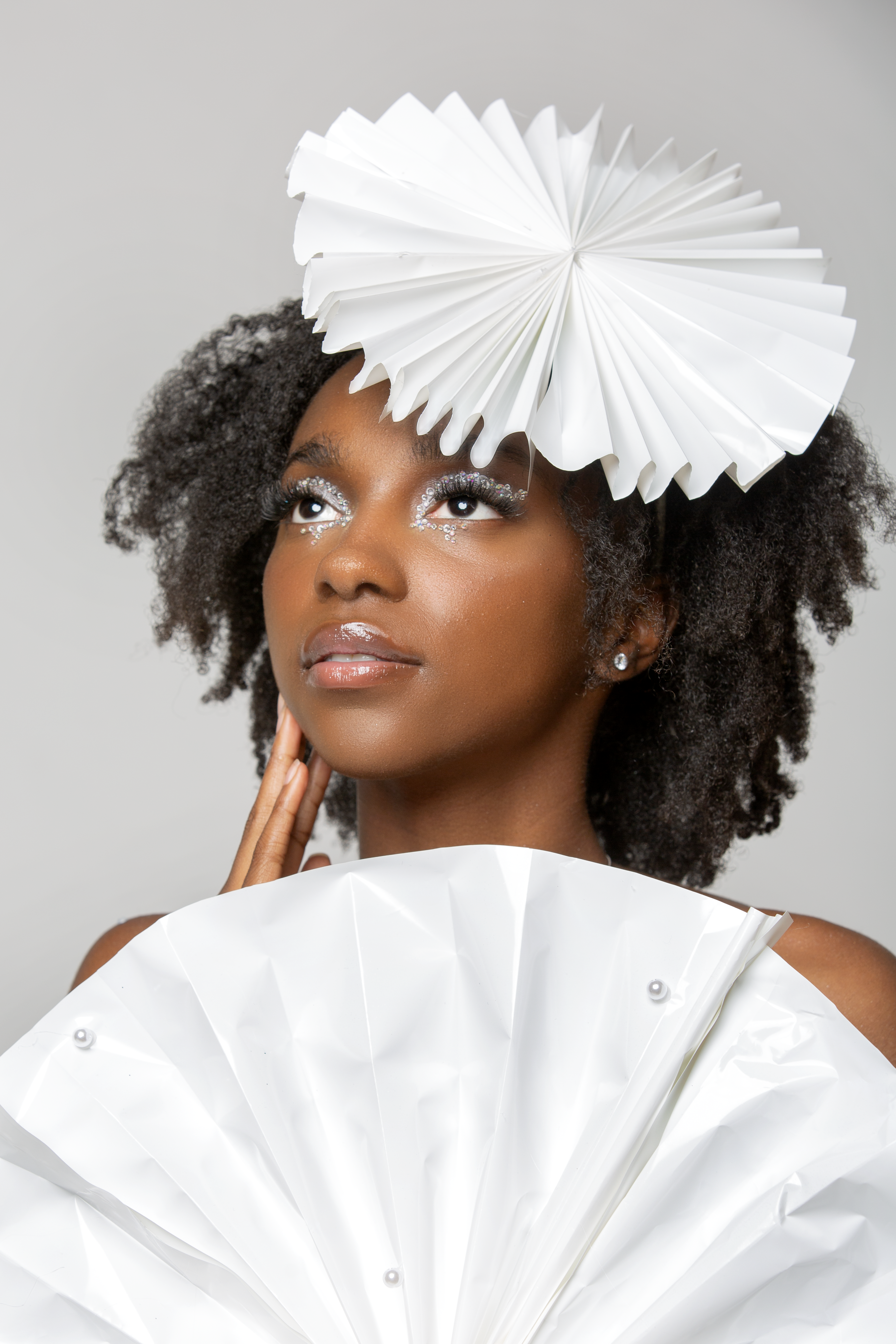 A Midtown High School student models innovative fashions created with all-recycled materials