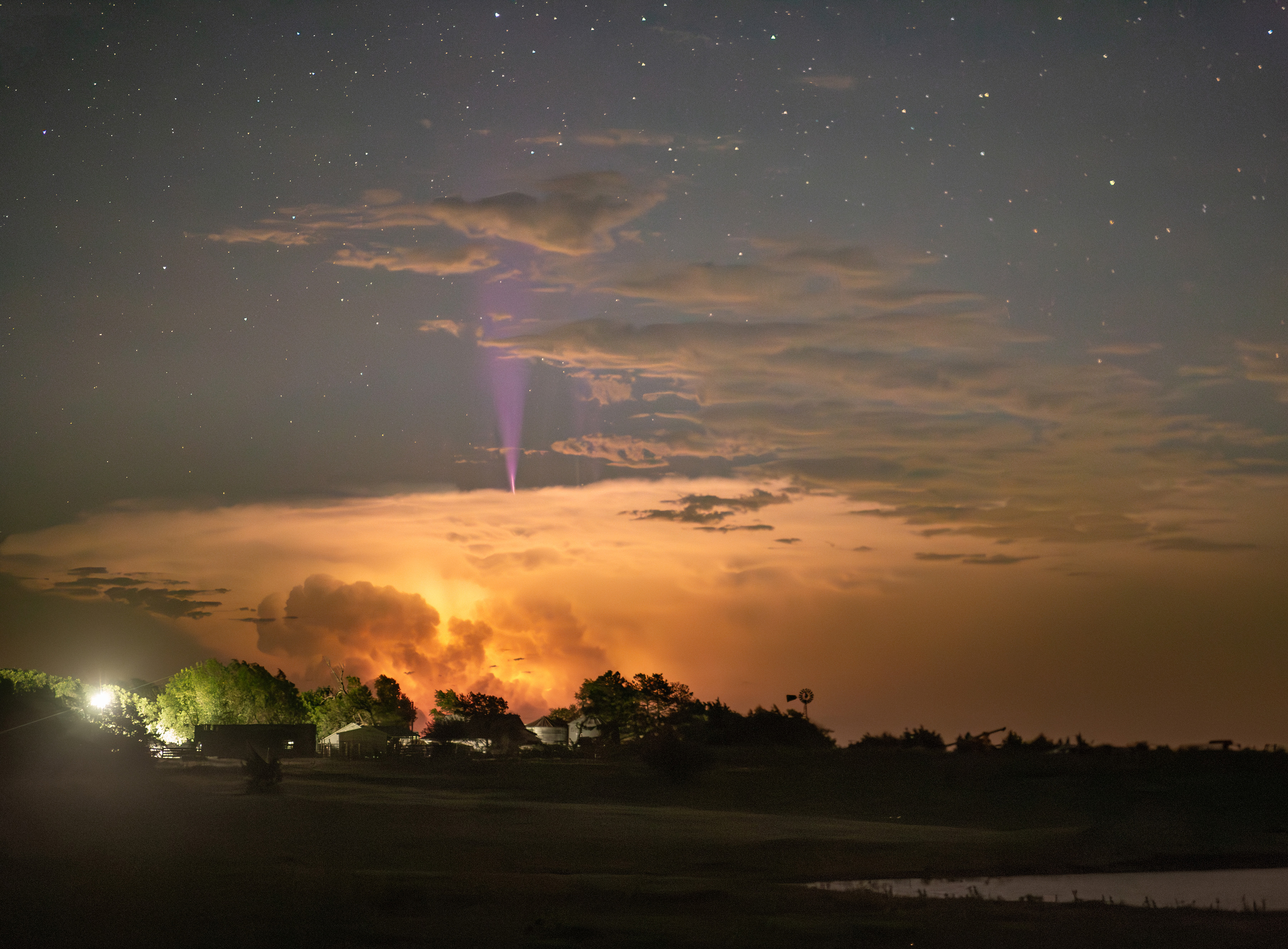Image of a blue jet rising above a thunderstorm.