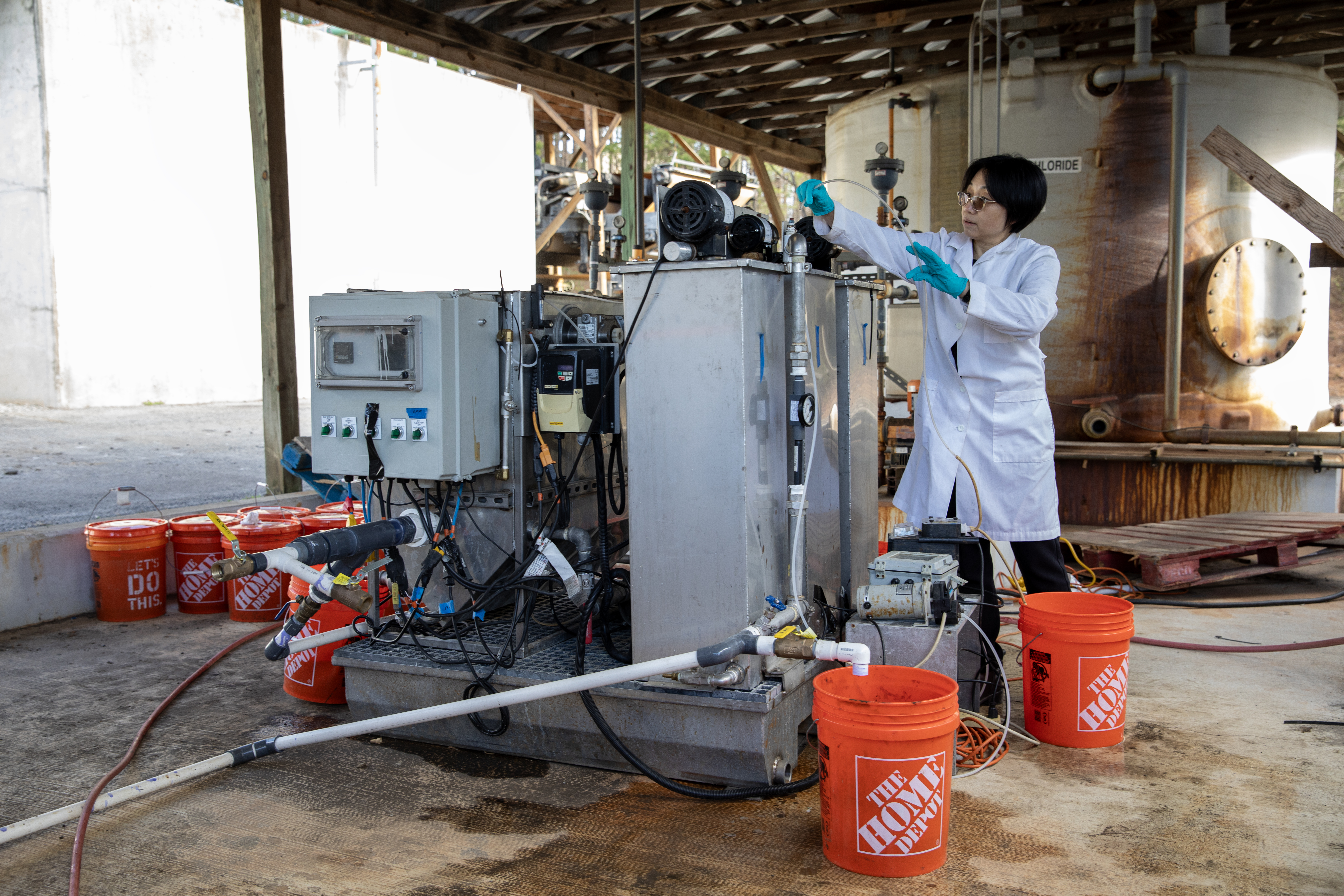 researcher with water purification equipment