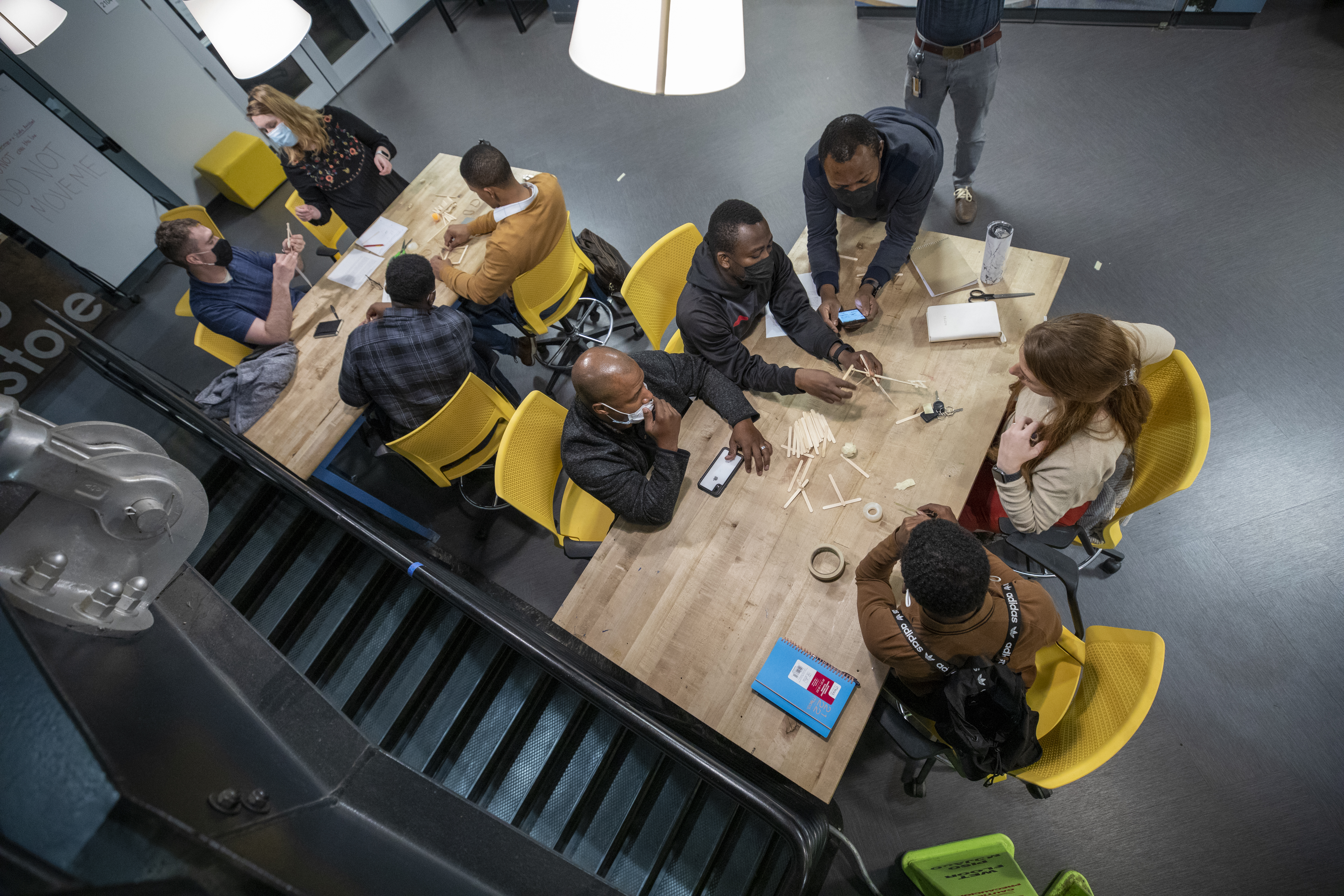 Participants at the Marne Innovation Workshop brainstorming solutions at a table. (Photo Credit: Sean McNeil)