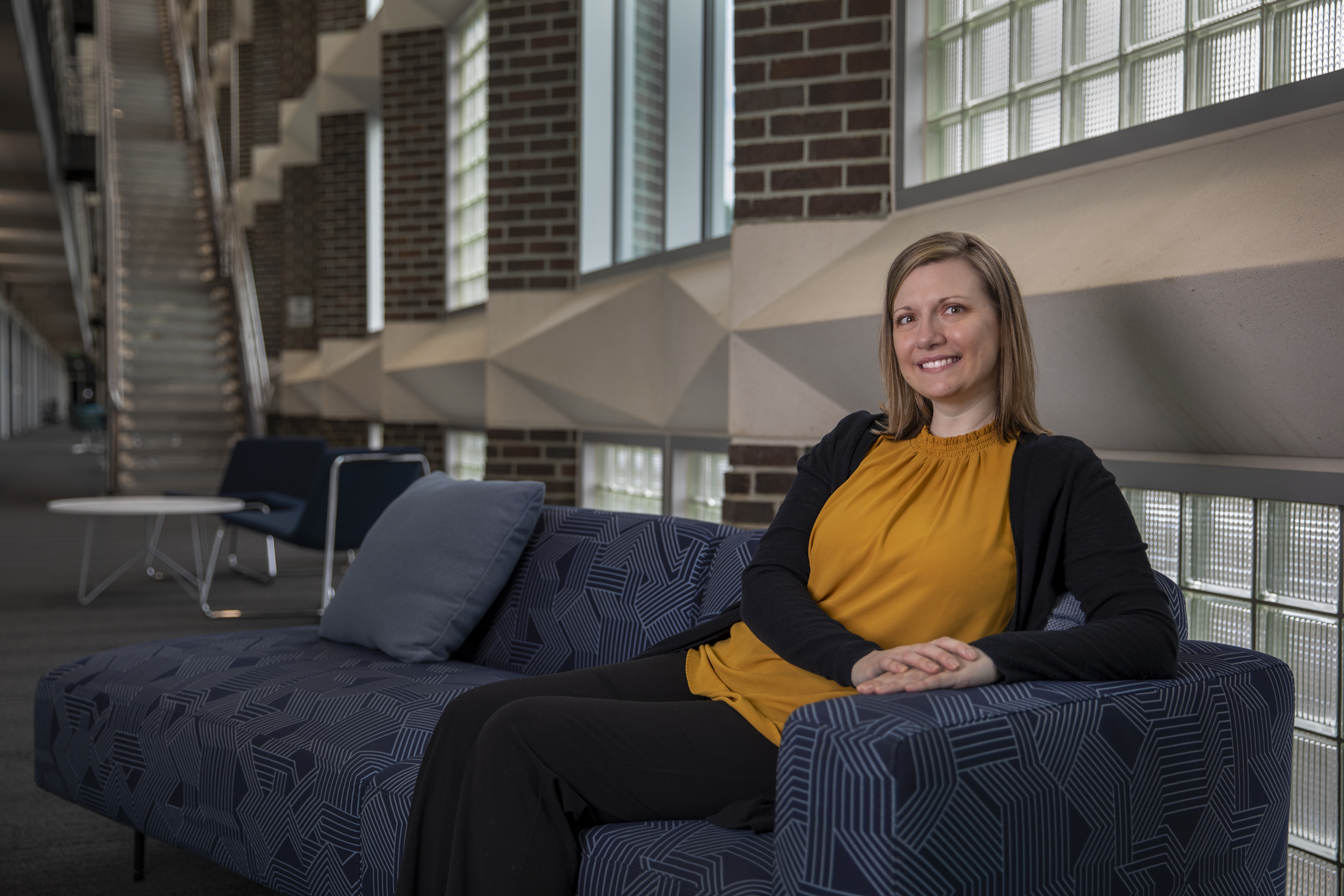 Liz Weldon sits inside the Cobb County Research Facility (CCRF), where she works as a senior research scientist in the Human Systems Engineering Branch.