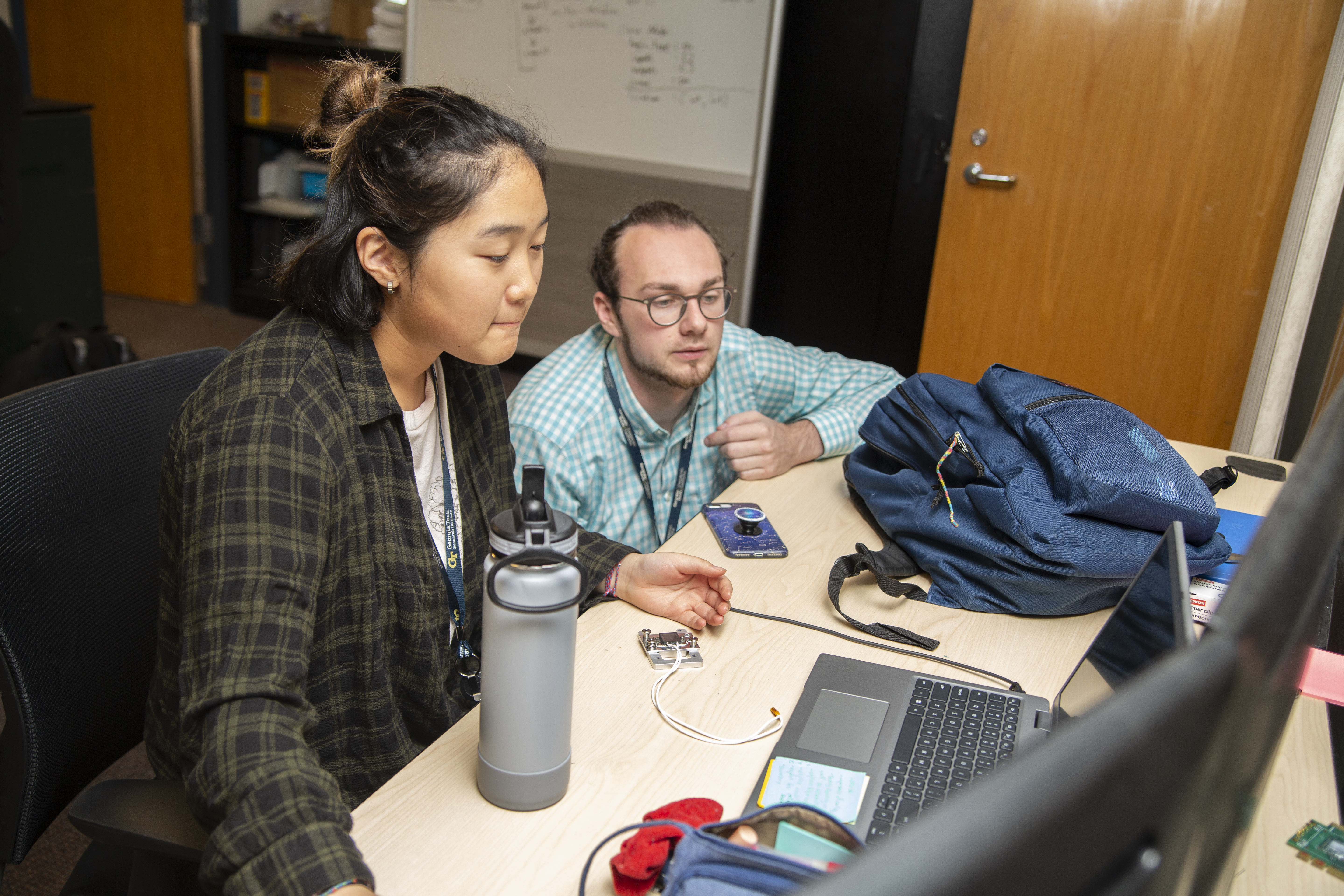 A GTRI mentor works with a high school intern (Photo Credit: Christopher Moore).