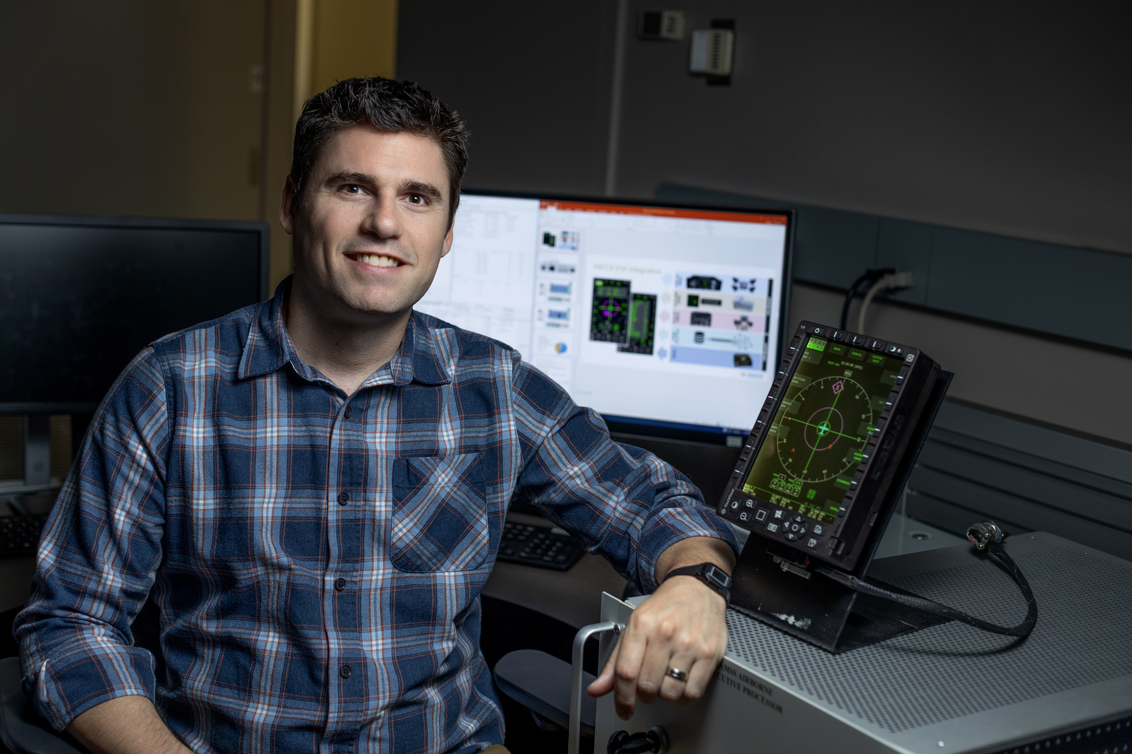 Clay Carpenter with aircraft display for the Advanced Integrated Electronic Combat Suite