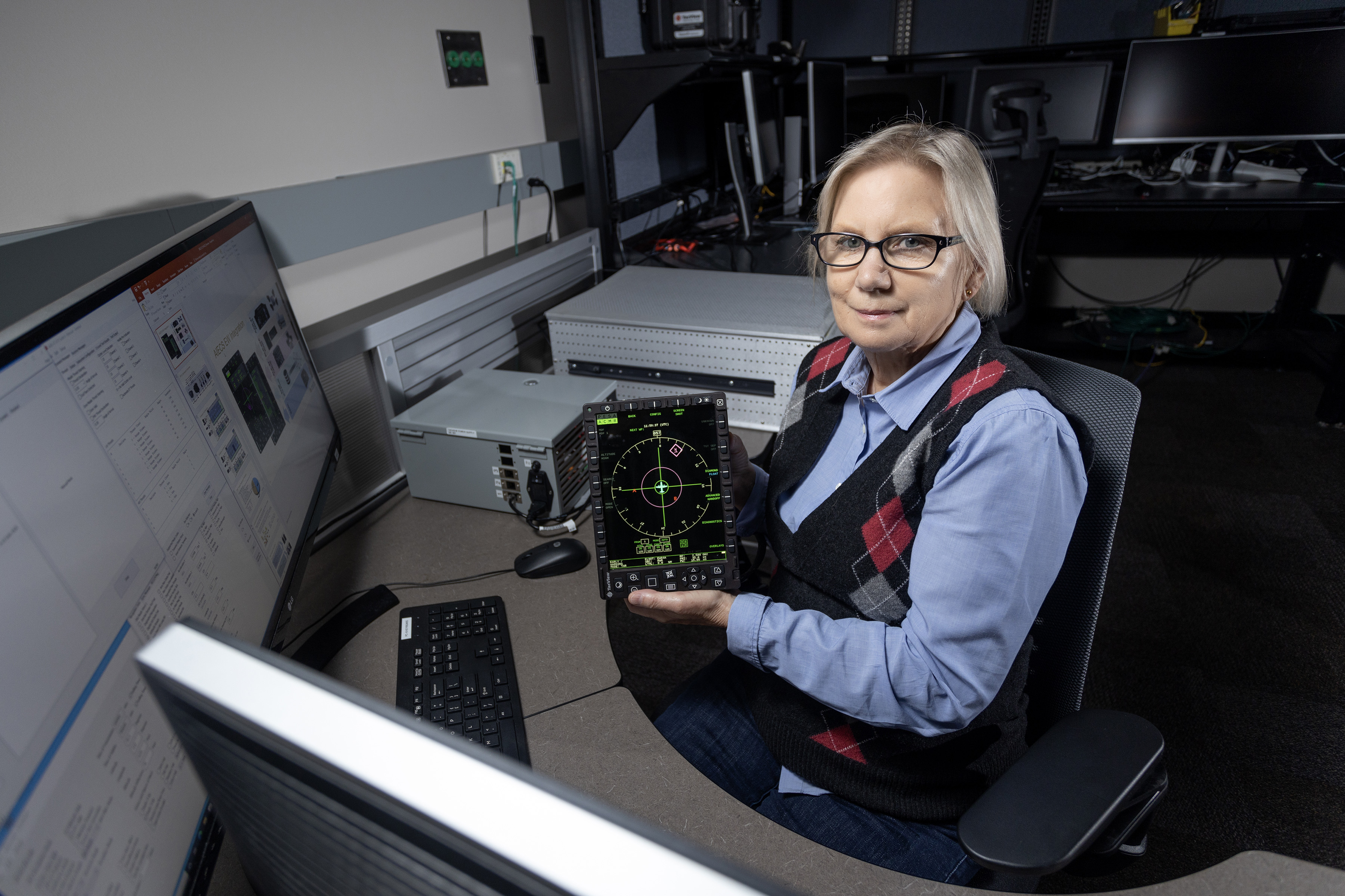 Linda Viney with aircraft display for the Advanced Integrated Electronic Combat Suite