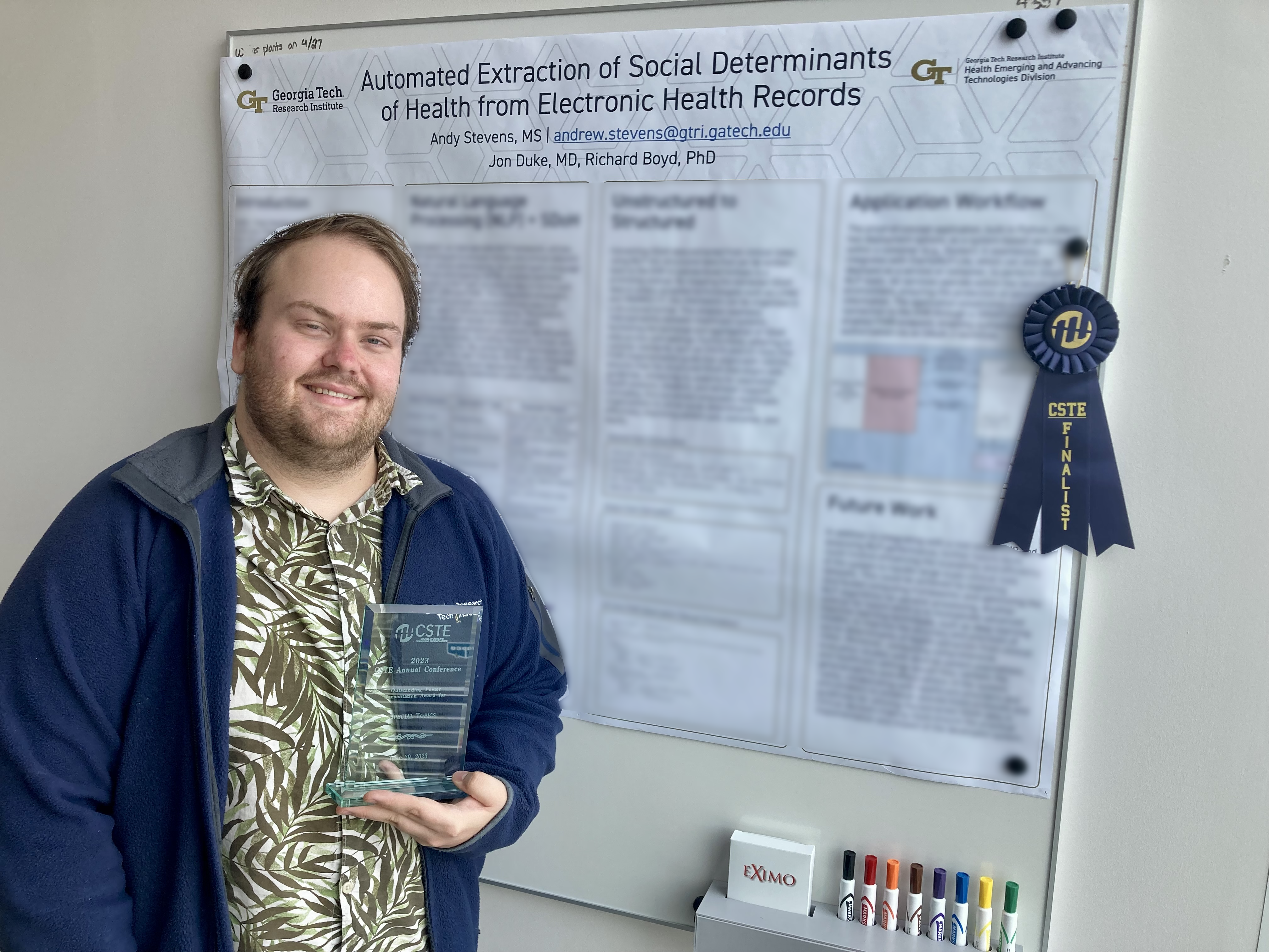 Andrew Stevens with award-winning poster.