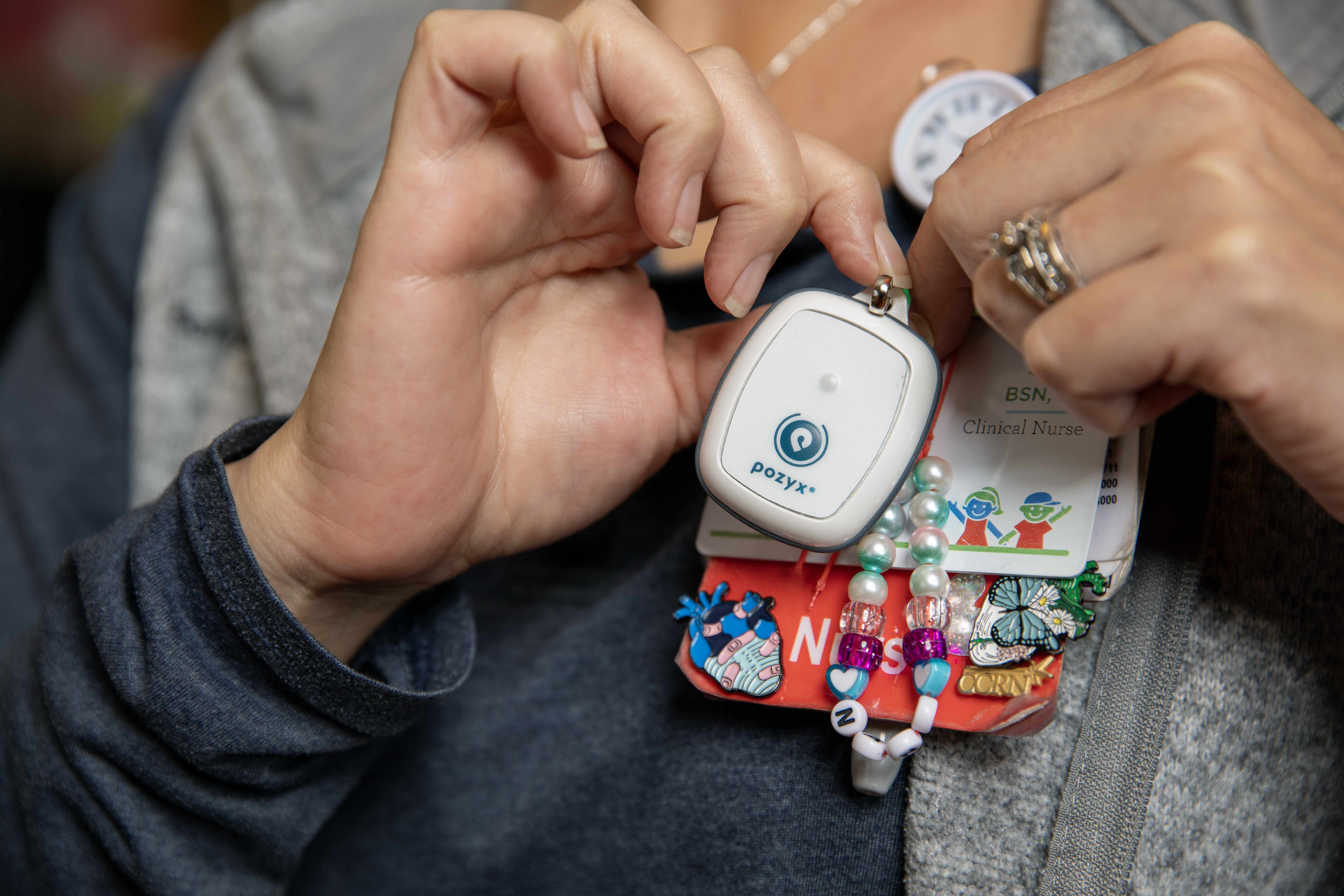 photo of nurse attaching sensor fob to her name badge