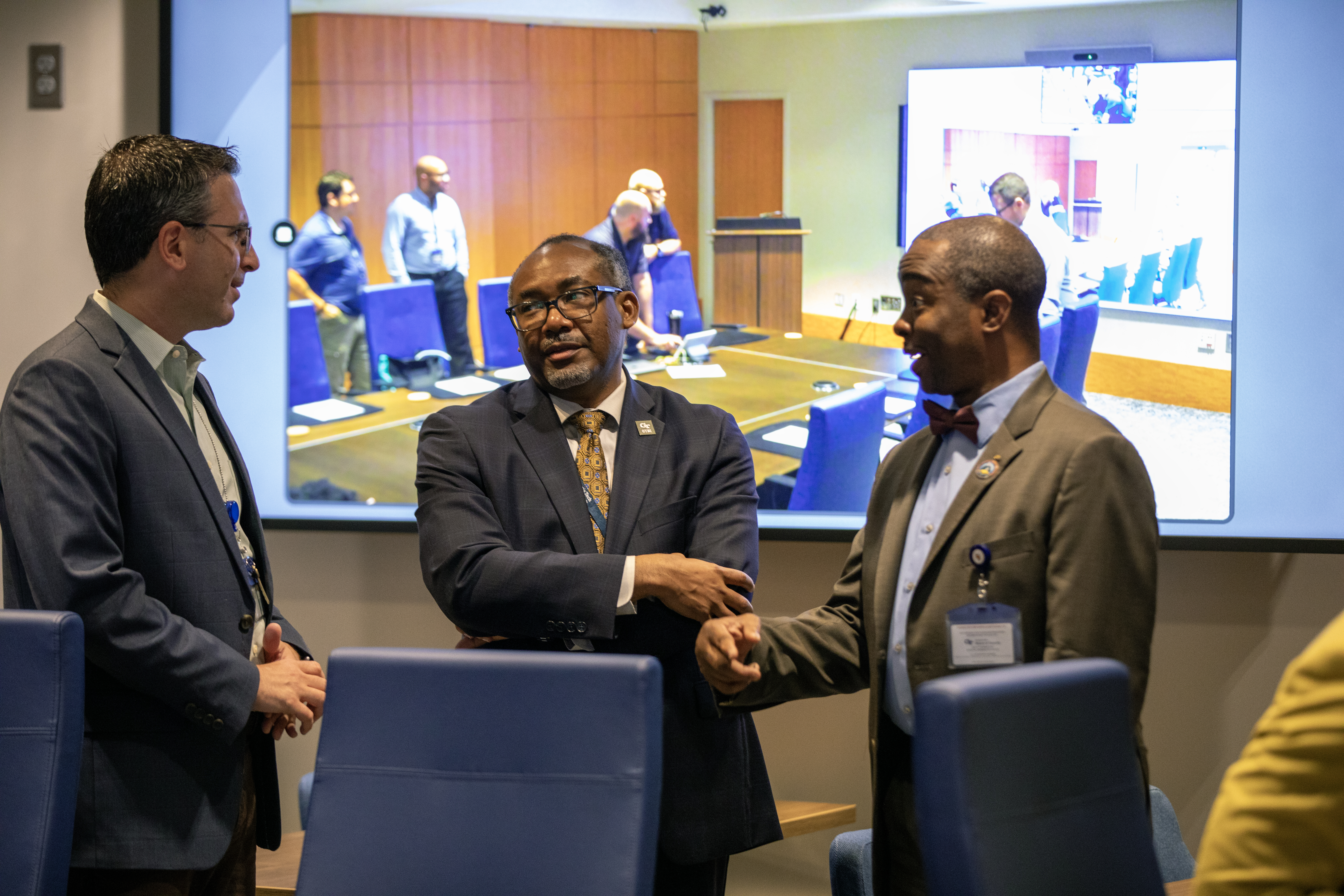 GTRI interim Director Tommer Ender and William Robinson, interim Chief Technology Officer, speak with Dr. Marcus Huggans, Executive Director, Client Relations at The National GEM Consortium (right).