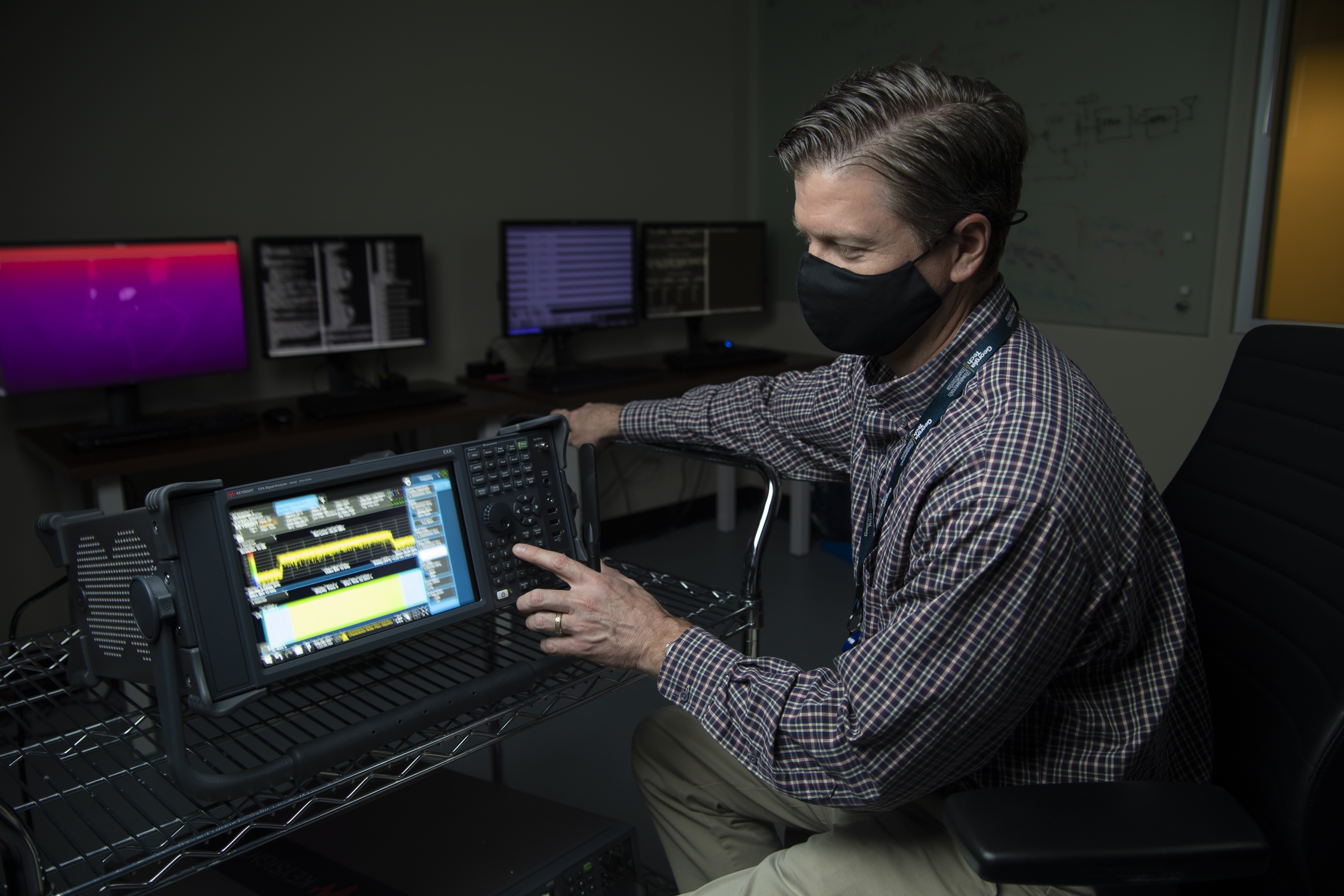 Photo showing a GTRI researcher conducting lab research. 