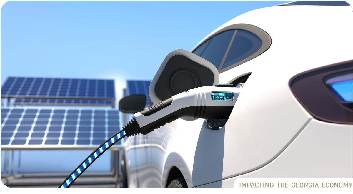 Electric car at charging station with solar panels in background