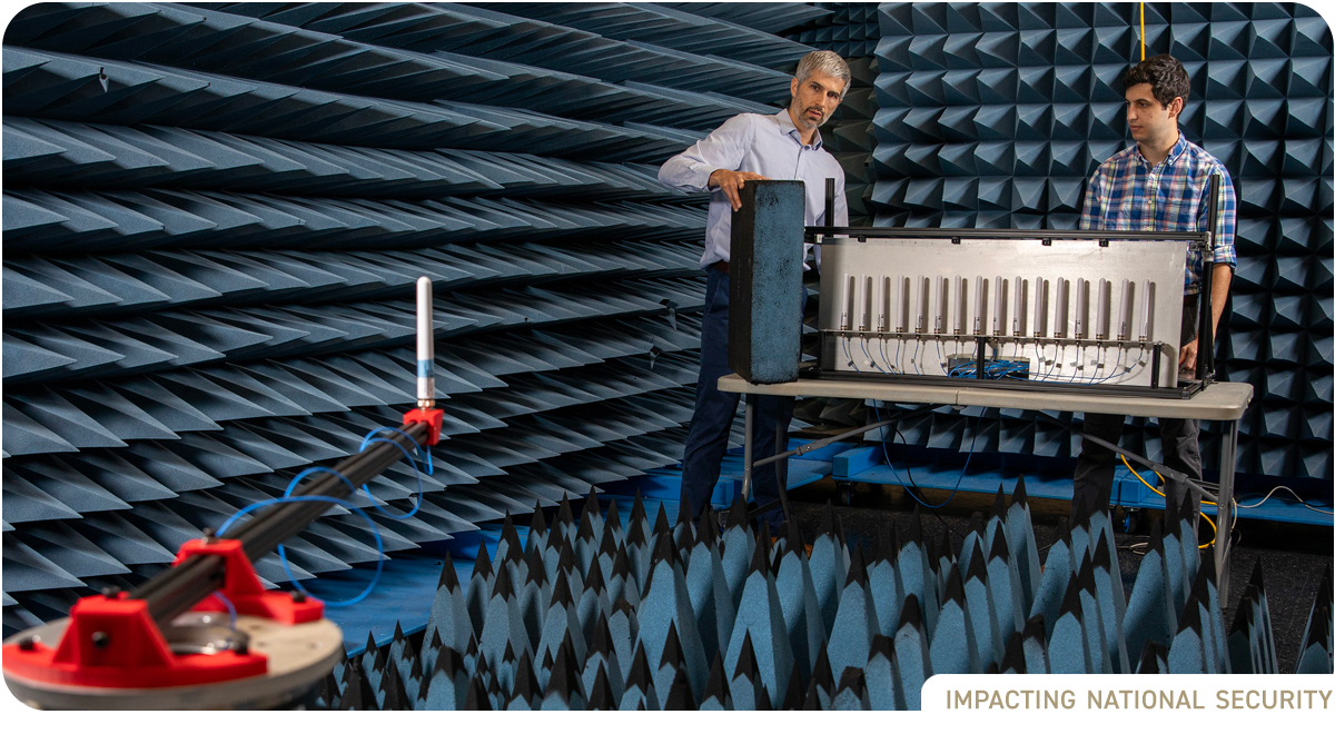 photo: two male researchers in sound chamber with testing equipment