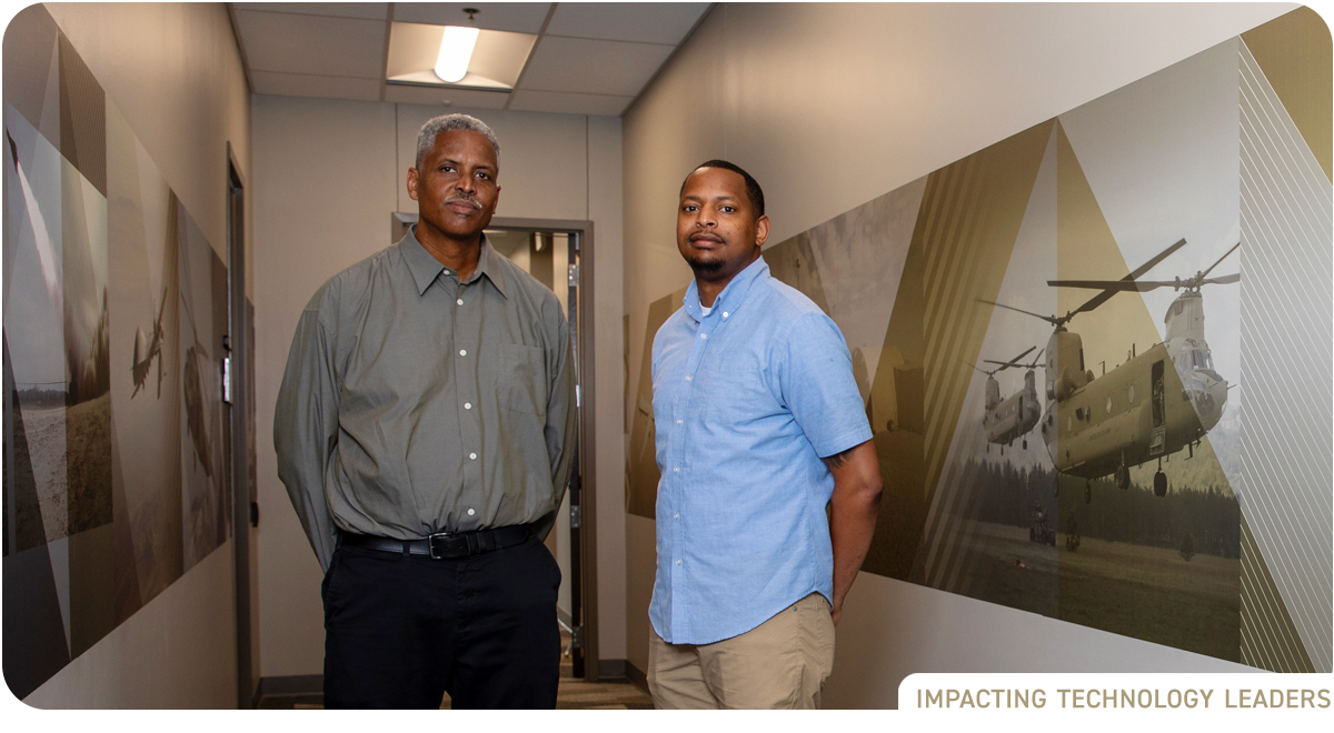 photo: two Black males standing in hallway at GTRI's Huntsville facility