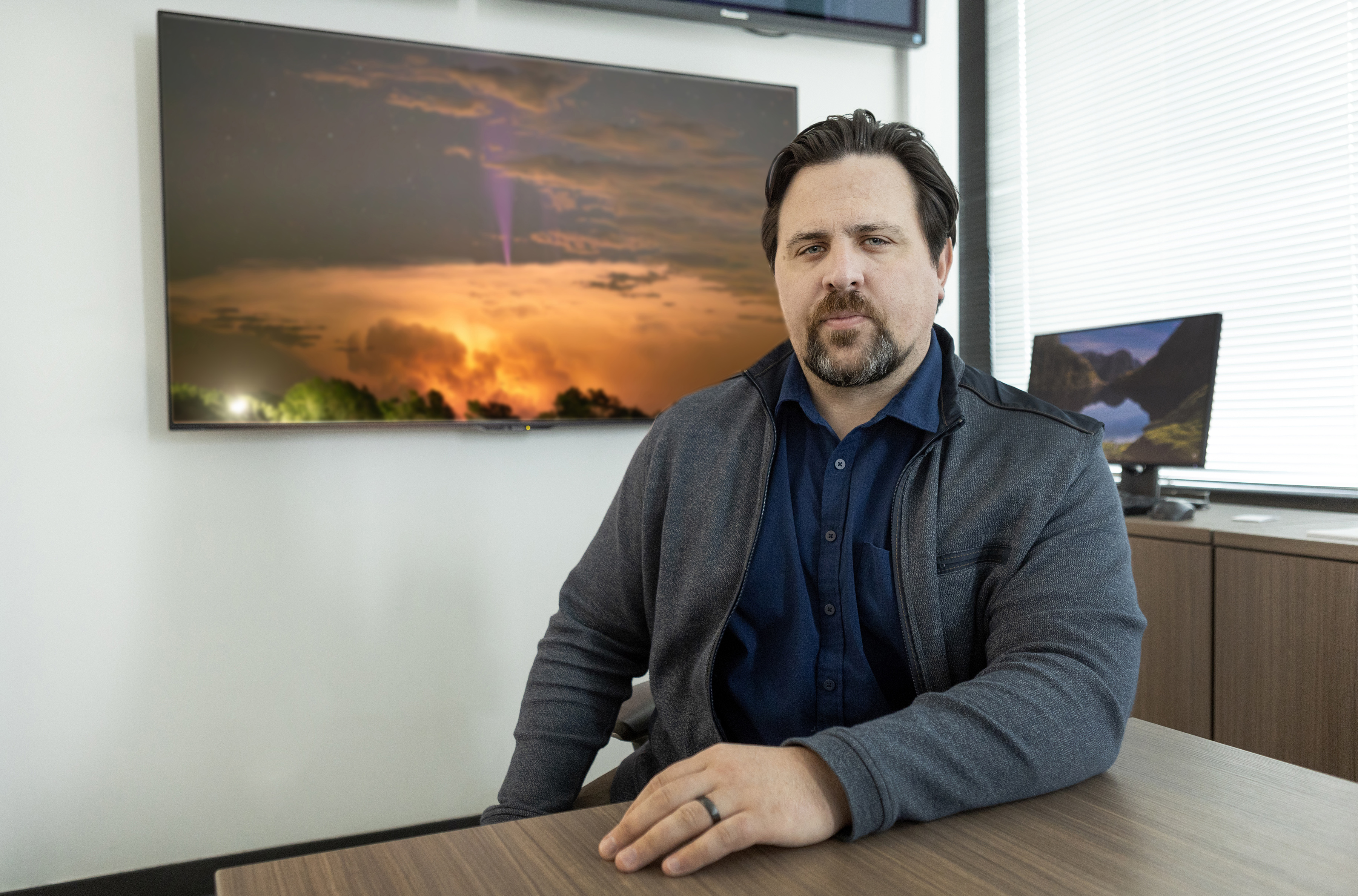 Researcher Levi Boggs with blue jet photo.