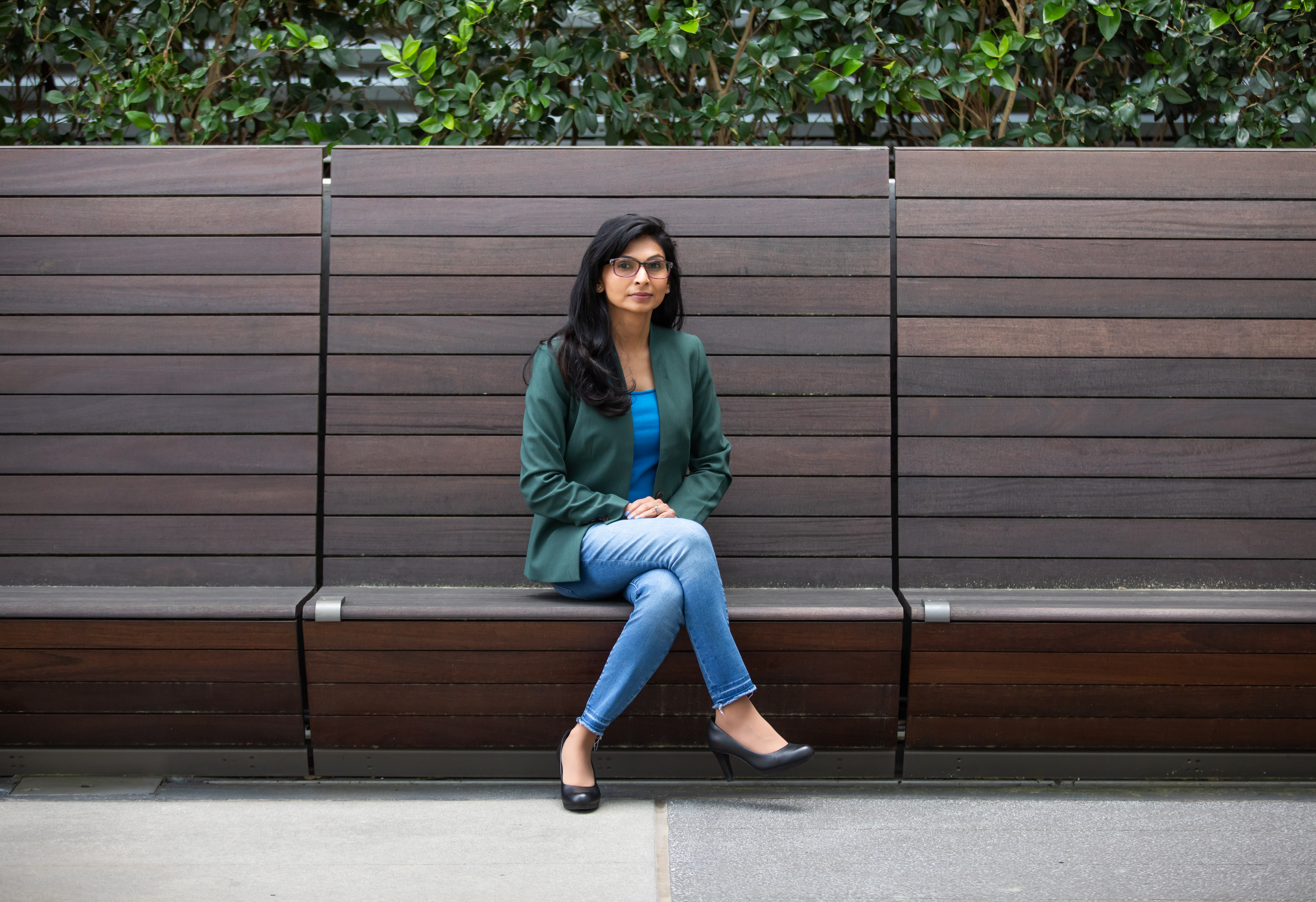 Gayatri Shah, a senior research engineer at Georgia Tech Research Institute's (GTRI) Project Management Support Office (PMSO), sits on a couch in the Coda building. (Credit: Branden Camp) 