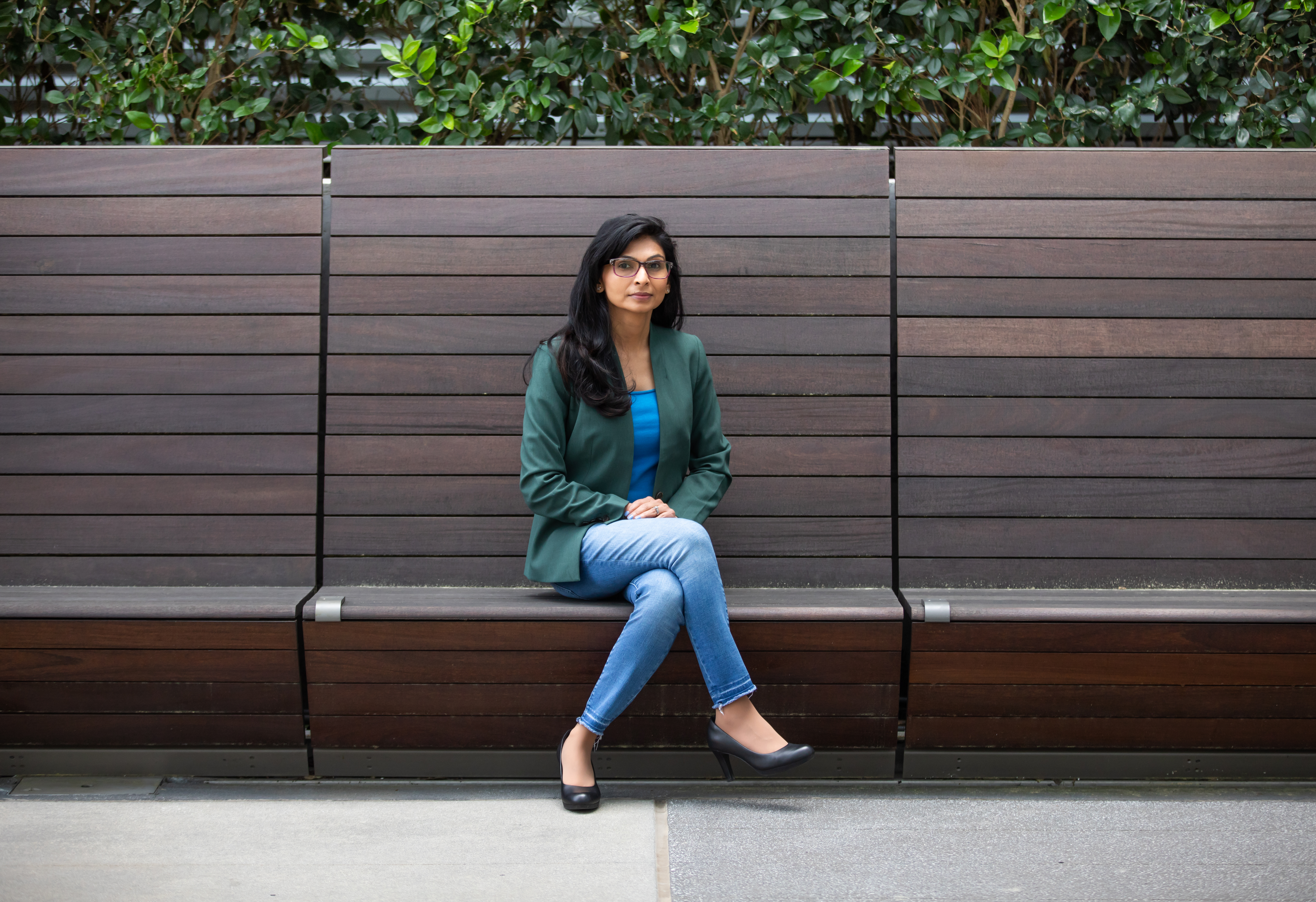 Gayatri Shah, a senior research engineer at Georgia Tech Research Institute's (GTRI) Project Management Support Office (PMSO), sits on a couch in the Coda building. (Credit: Branden Camp)