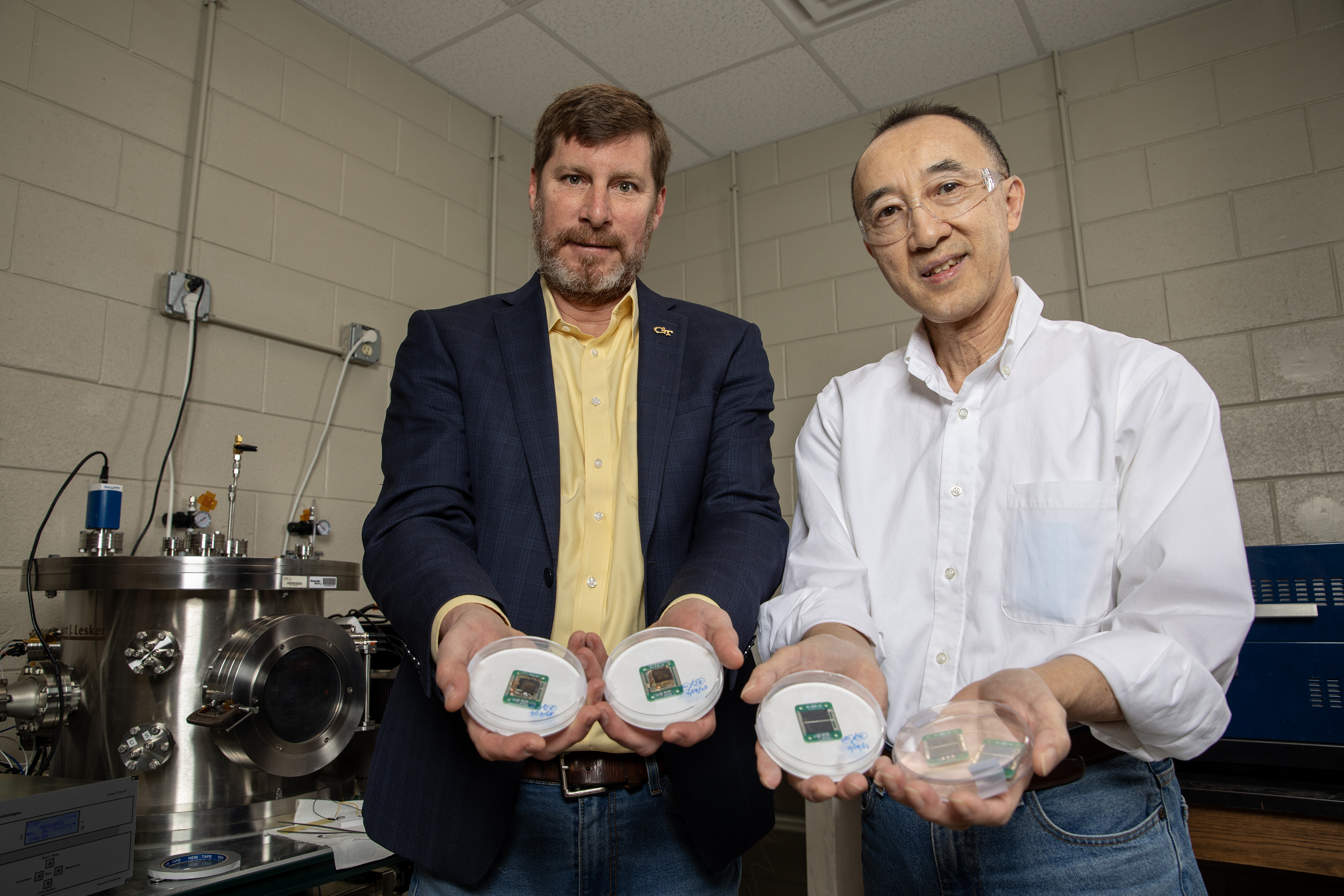 Researchers with solar cells for testing