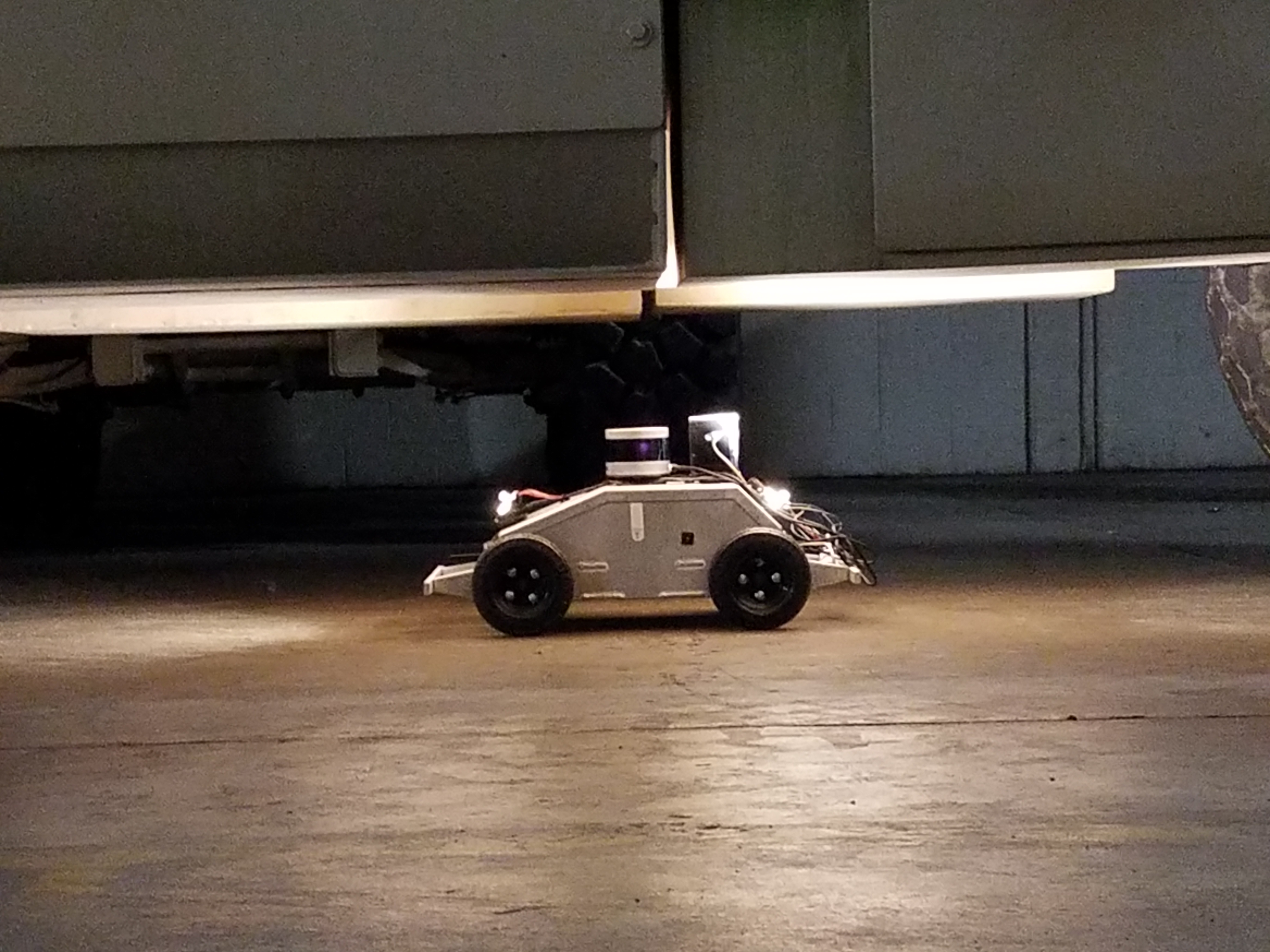 ARTI taking pictures of a vehicle undercarriage using its cameras and “flash.”(Photo credit: Matthew Marcum)