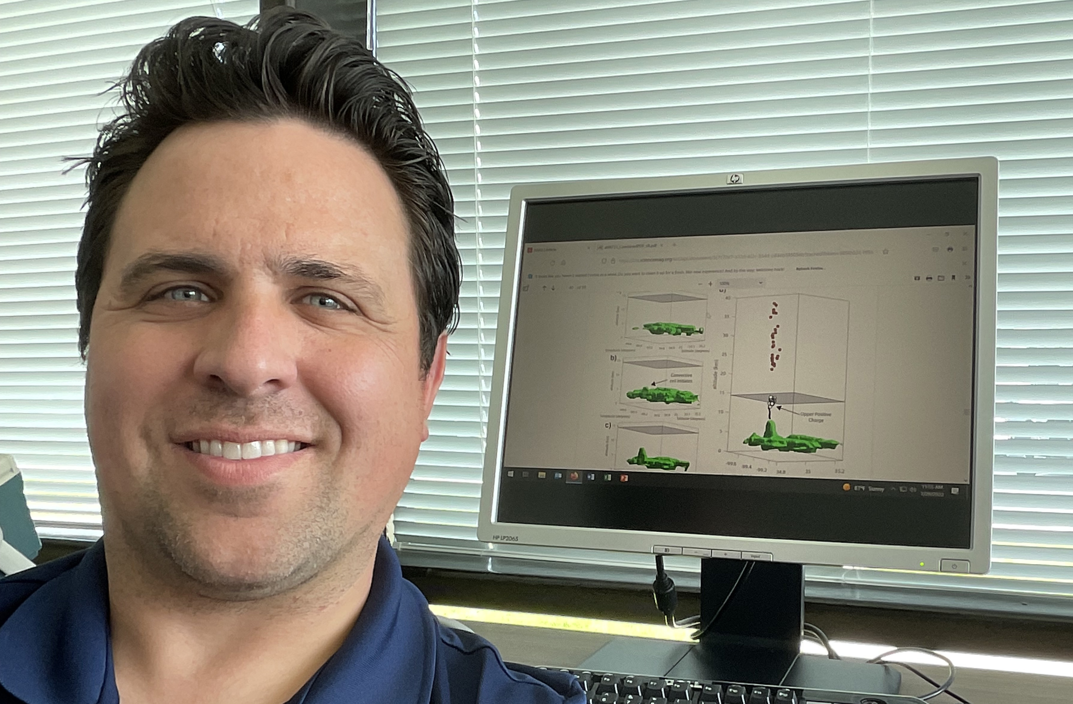 Researcher Levi Boggs with a schematic