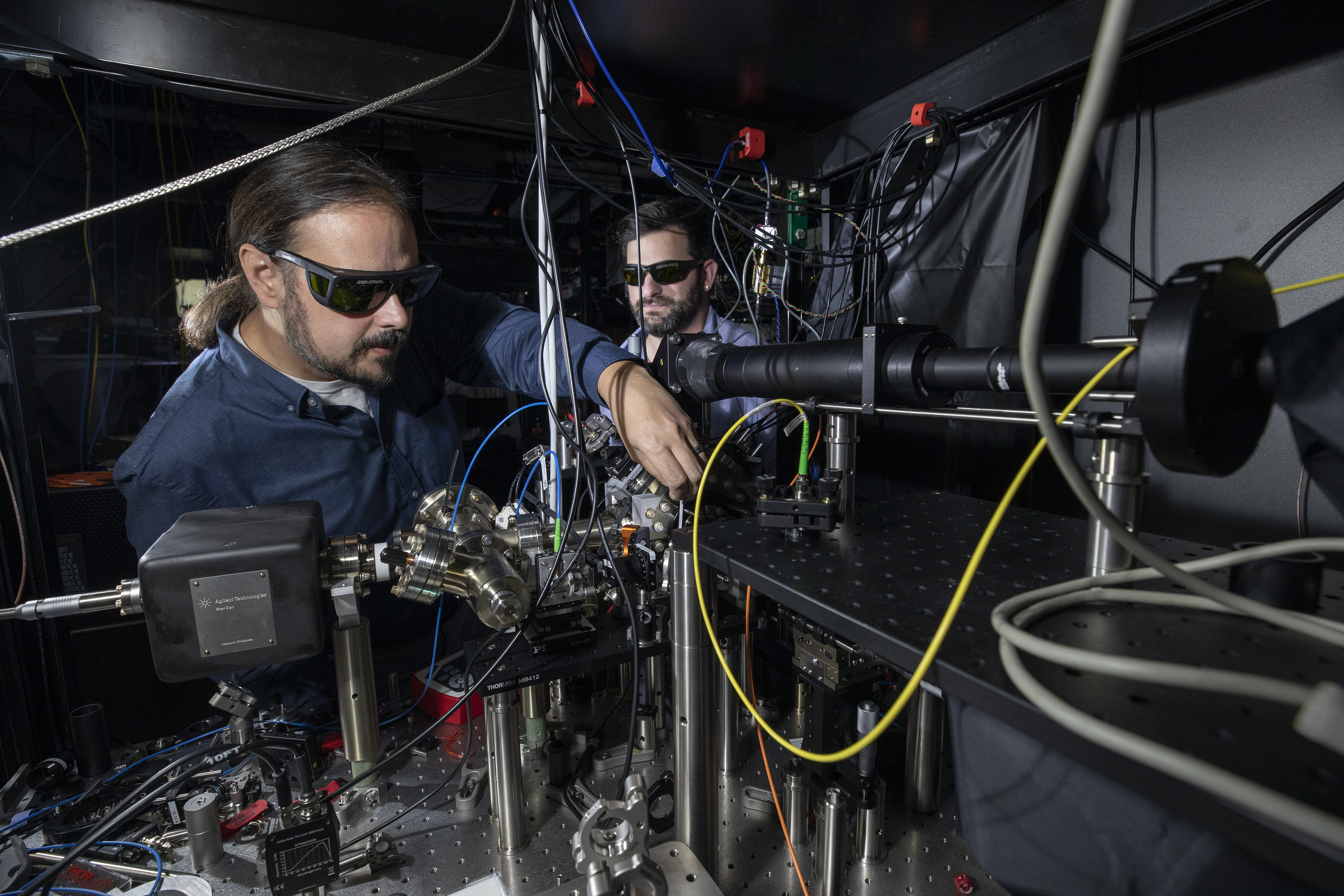 Researcher adjusts cooling beam for Penning trap