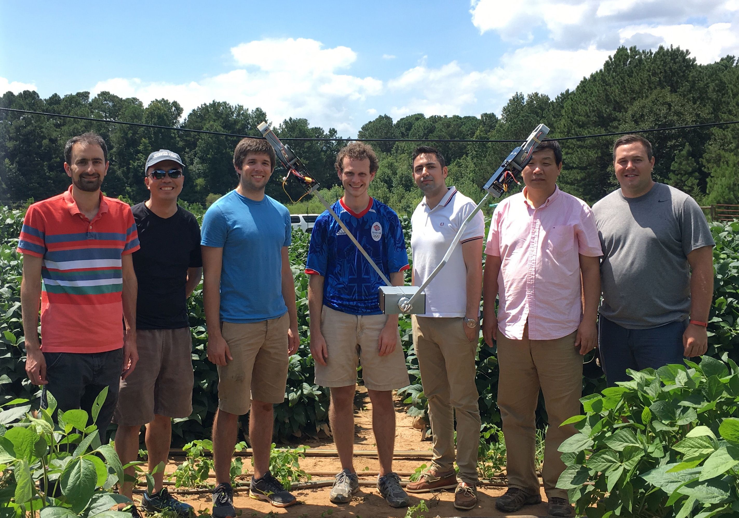 The Tarzan robot team shown during testing in a soybean field. 