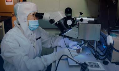 researcher shown wire bonding photovoltaic cell to a package