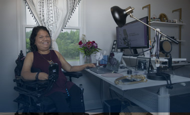 Liz Persaud is shown working from home, raising awareness and increasing independence for the disability community through the Center for Inclusive Design and Innovation at Georgia Tech. (Credit: Sean McNeil, GTRI) 