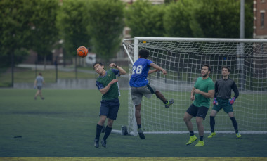 A players is able to execute a header to keep the soccer ball from getting to close to their goal. (Photo Credit: Christopher Moore)