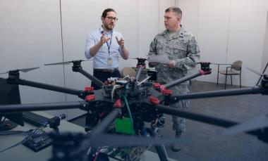 two researchers with UAV