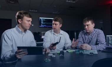 three researchers with internet of things devices