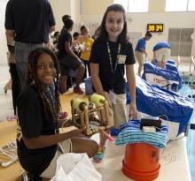 Student competitors work on their underwater ROV during the competition.