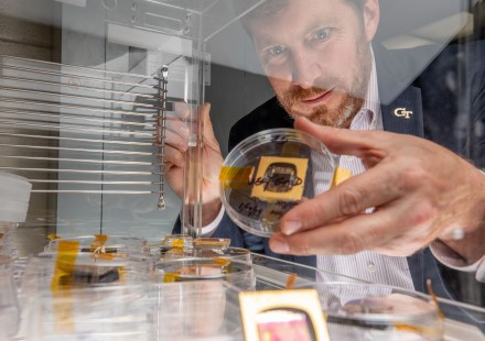 GTRI-Principal-Research-Engineer-Jud-Ready-holds-a-sample-of-a-perovskite-solar-cell-along-with-other-samples-similar-to-those-launched-to-the-International-Space-Station.
