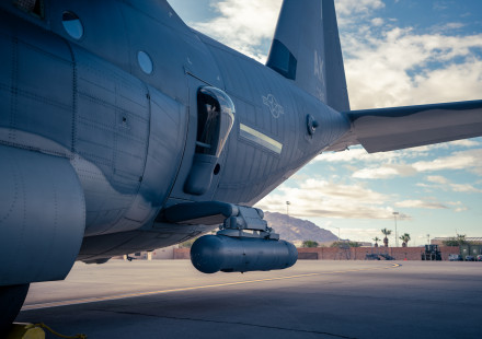 Using an articulated arm called the SABIR AS-7 STRUT, Northrop Grumman’s LITENING targeting pod can be mounted onto the paratroop door of an HC-130J. (Photo credit: Taylor Cifuentes)