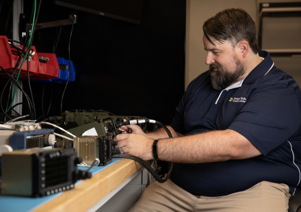 Researcher works on the GTRI-developed pilot vehicle interface.