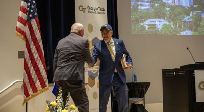 USG Chancellor Sonny Perdue and Georgia Tech President Angel Cabrera shake hands during 90th Anniversary Celebration event.