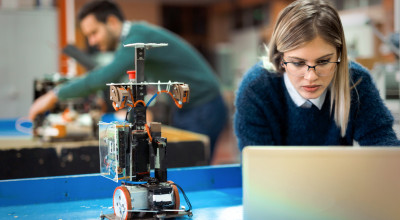 Young researcher--with robotics project. Stock image.