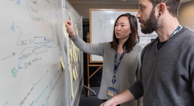 GTRI-Research-Scientist-Andrew-Baranak-and-Georgia-Tech-Graduate-Student-Rachel-Chen-discuss-creating-user-interface-workflows-for-the-mission-planning-task