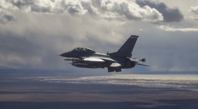 An F-16D prepares to drop four Collaborative Small Diameter Bombs
