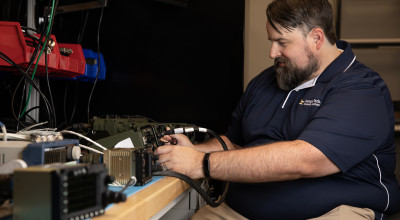 Researcher works on the GTRI-developed pilot vehicle interface.