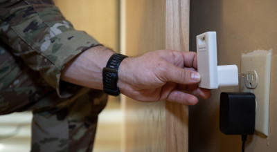 Prototype MCAT device is placed in a wall outlet.