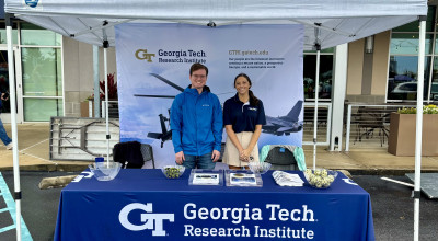 Ian Slamen and Morgan McBride welcome attendees to the GTRI booth.