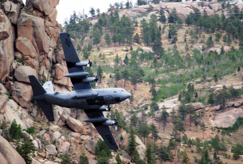 Plane flying near mountains